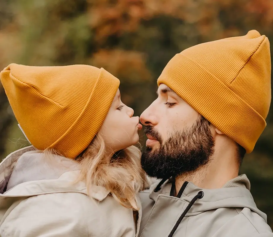 Little girl with her dad on autumn holidays